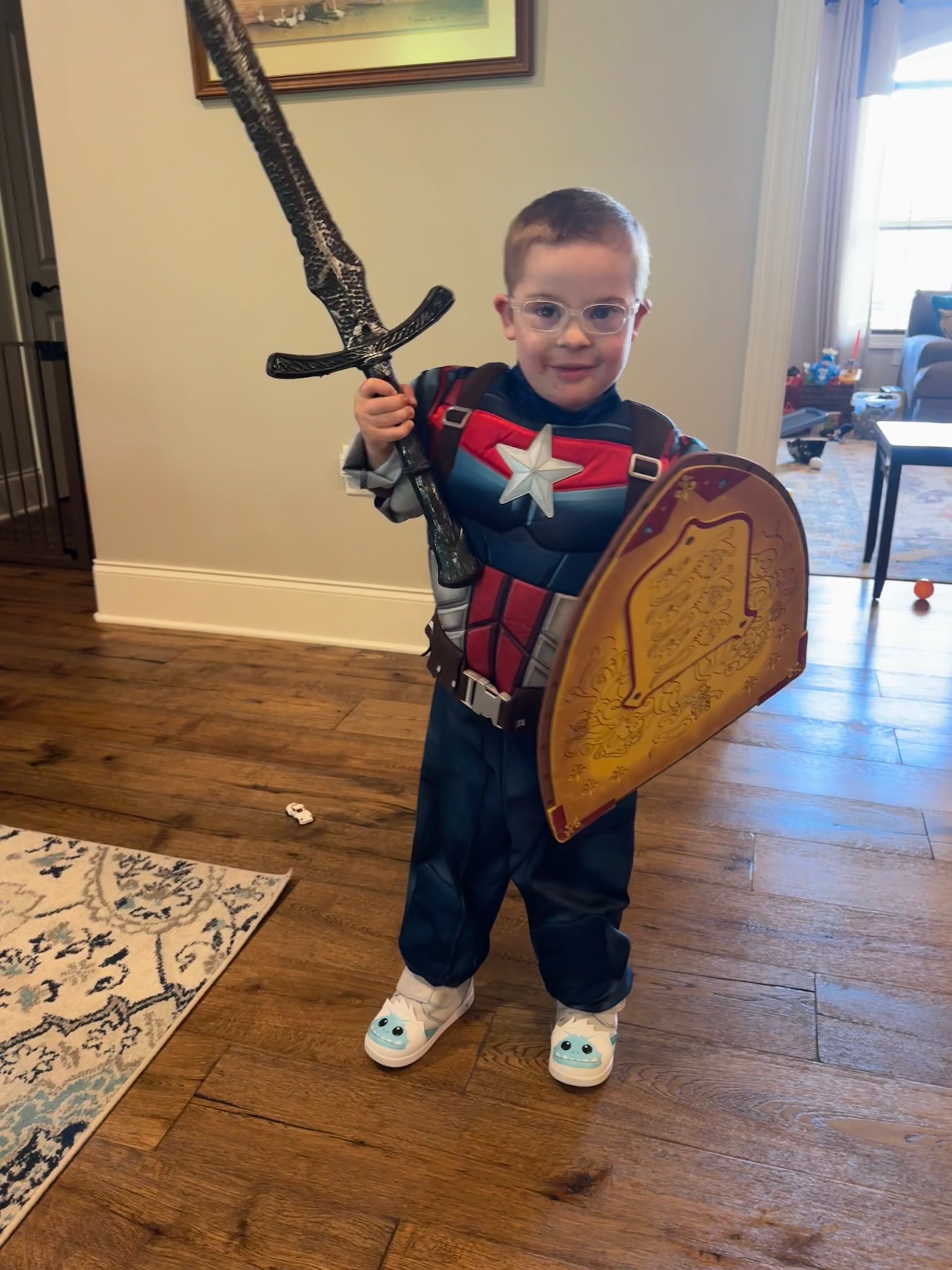 Charlie dressed as Captain America with a sword and shield