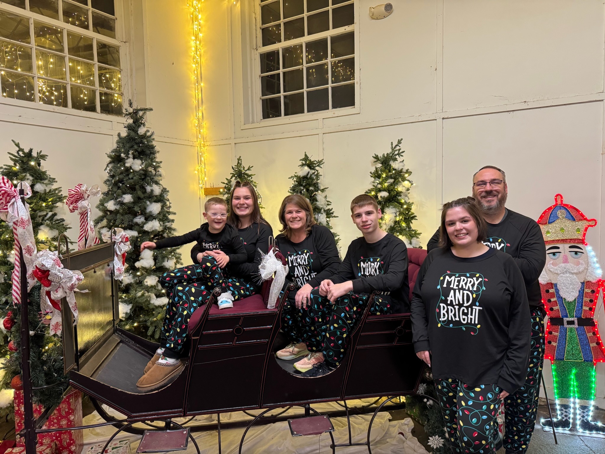 The whole Johnson family in matching Christmas pajamas